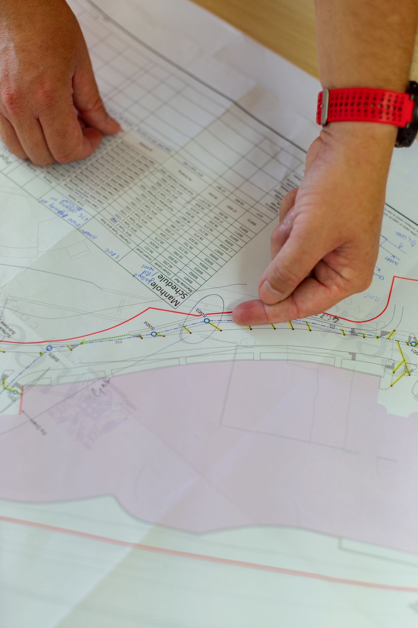 Construction drawings marked up by hand during a technical review