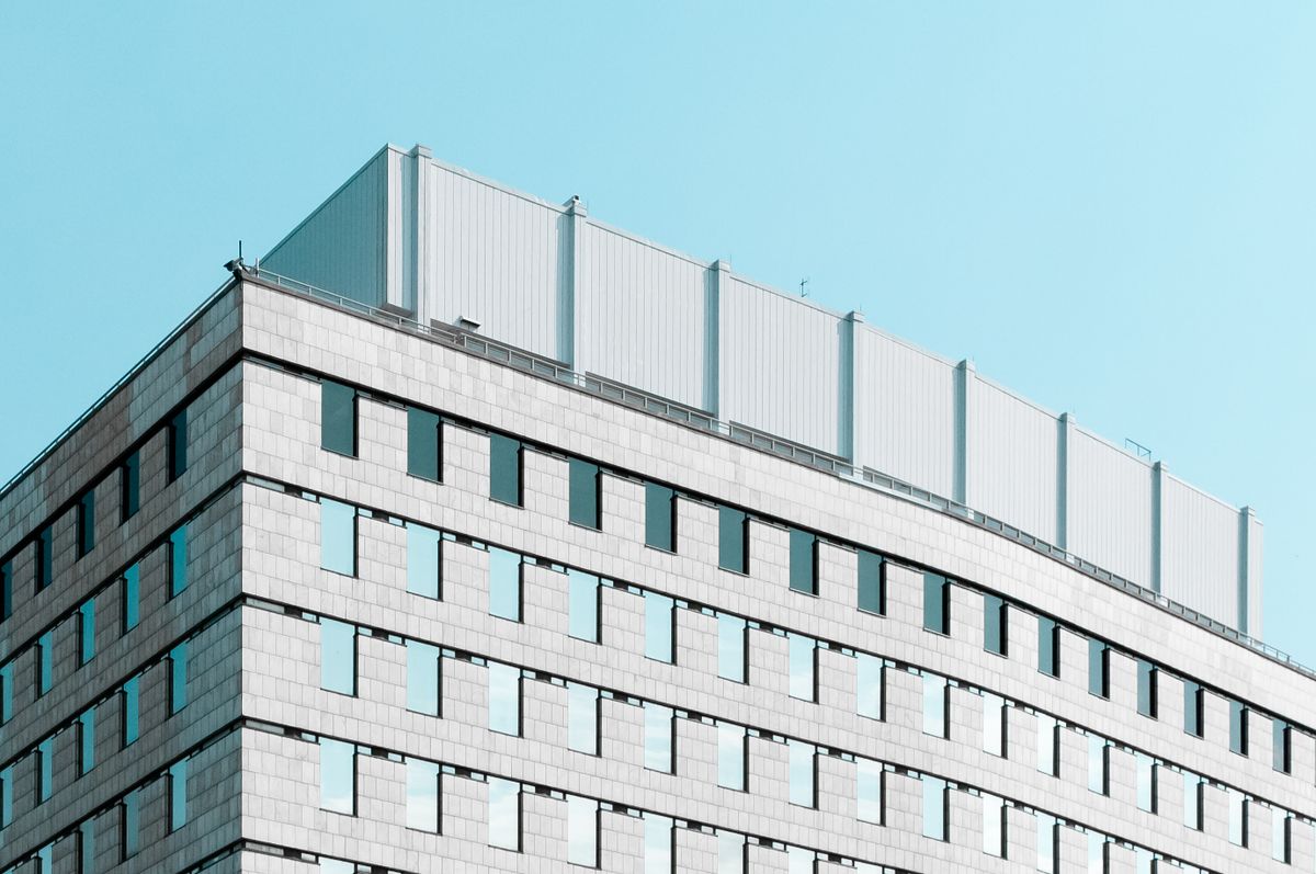 Office building facade against a clear sky